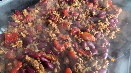 Close-up of ground beef chili with red beans and tomatoes for Chili Cornbread Casserole.