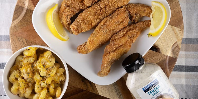 Golden-brown, crispy Southern Fried Fish served with lemon wedges and tartar sauce