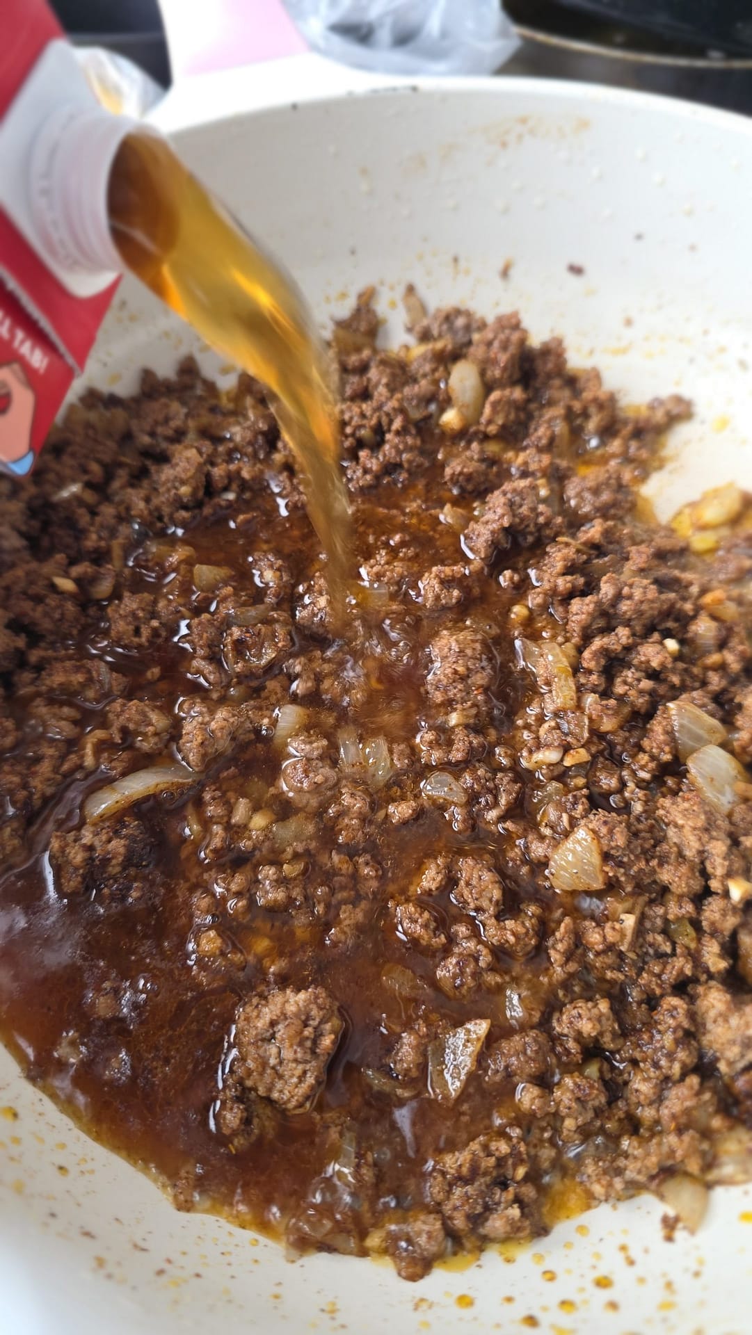 Chili base simmering with beans and tomatoes